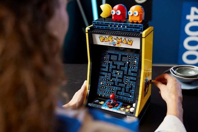 Person playing Lego Pac-Man Arcade