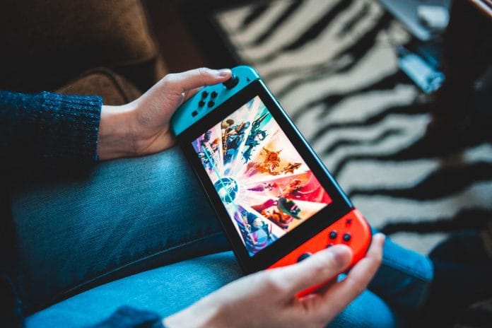 Person playing with Nintendo Switch
